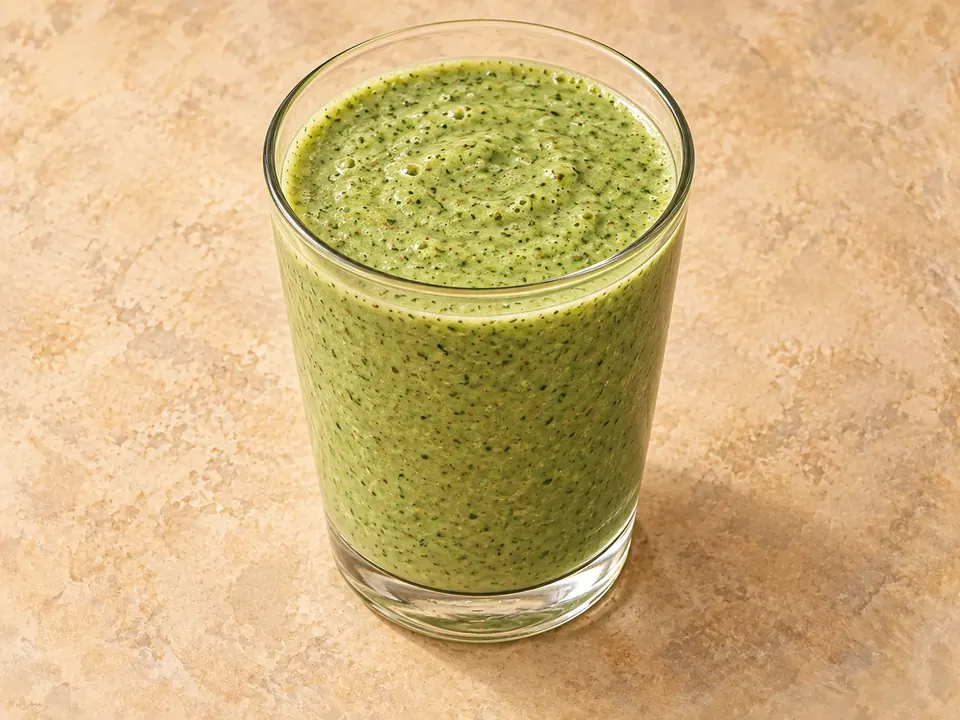 Illustration of a blended cucumber, spinach and lime smoothie with Greek yogurt and flaxseed.